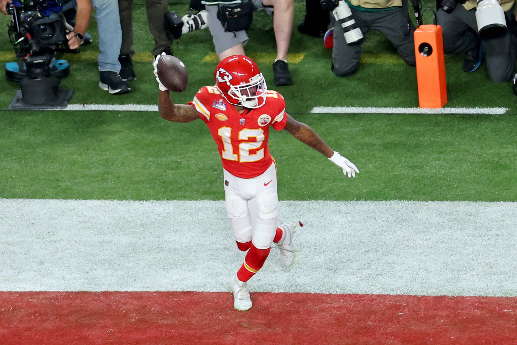 LAS VEGAS, NEVADA - FEBRUARY 11: Mecole Hardman Jr. #12 of the Kansas City Chiefs celebrates after catching the game-winning touchdown in overtime to defeat the San Francisco 49ers 25-22 during Super Bowl LVIII at Allegiant Stadium on February 11, 2024 in Las Vegas, Nevada.