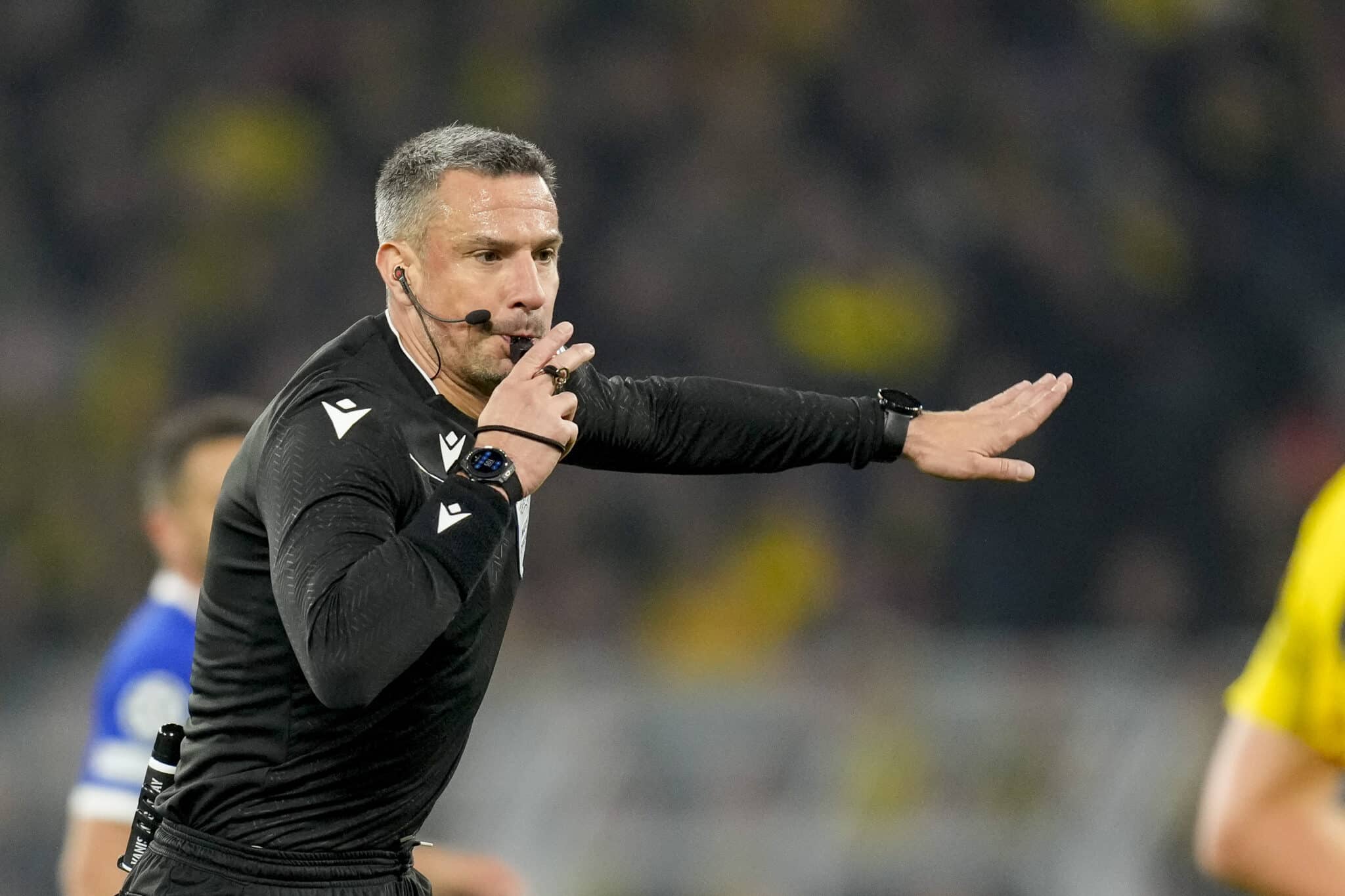 DORTMUND, GERMANY - APRIL 16: referee Slavko Vincic gestures during the UEFA Champions League quarter-final second leg match between Borussia Dortmund and Atletico Madrid at Signal Iduna Park on April 16, 2024 in Dortmund, Germany.