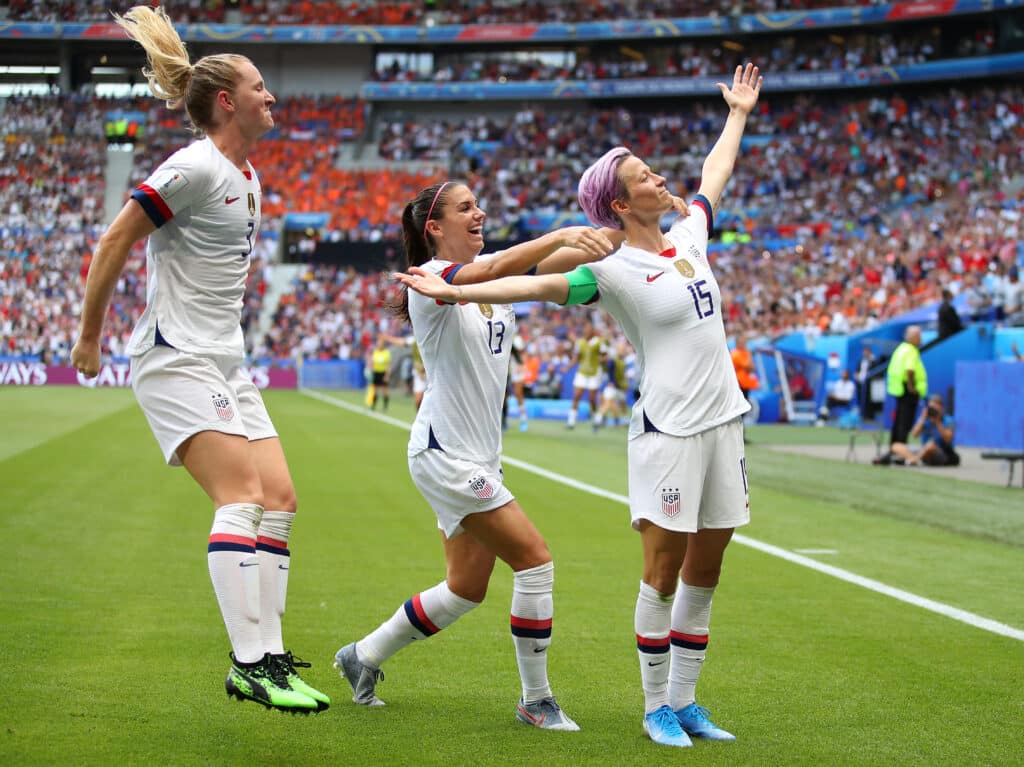 Megan Rapinoe of the USA celebrates scoring the first goal from the penalty spot with Alex Morgan during the 2019 FIFA Women's World Cup France Final match between The United State of America and The Netherlands at Stade de Lyon 