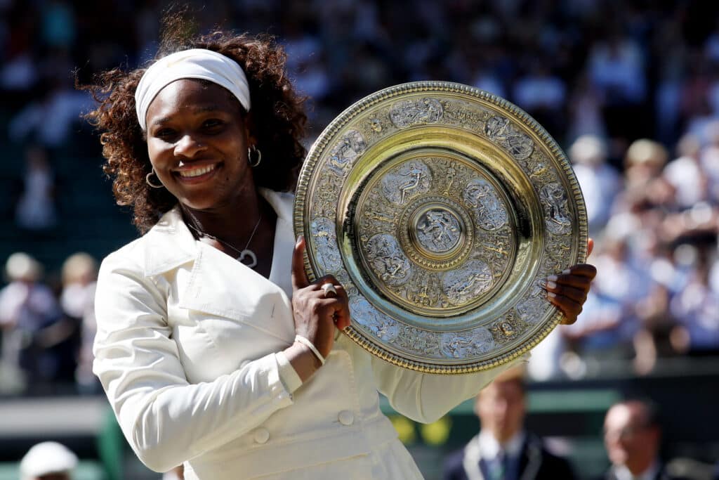 Serena Williams celebrates in her white outfit at Wimbledon
