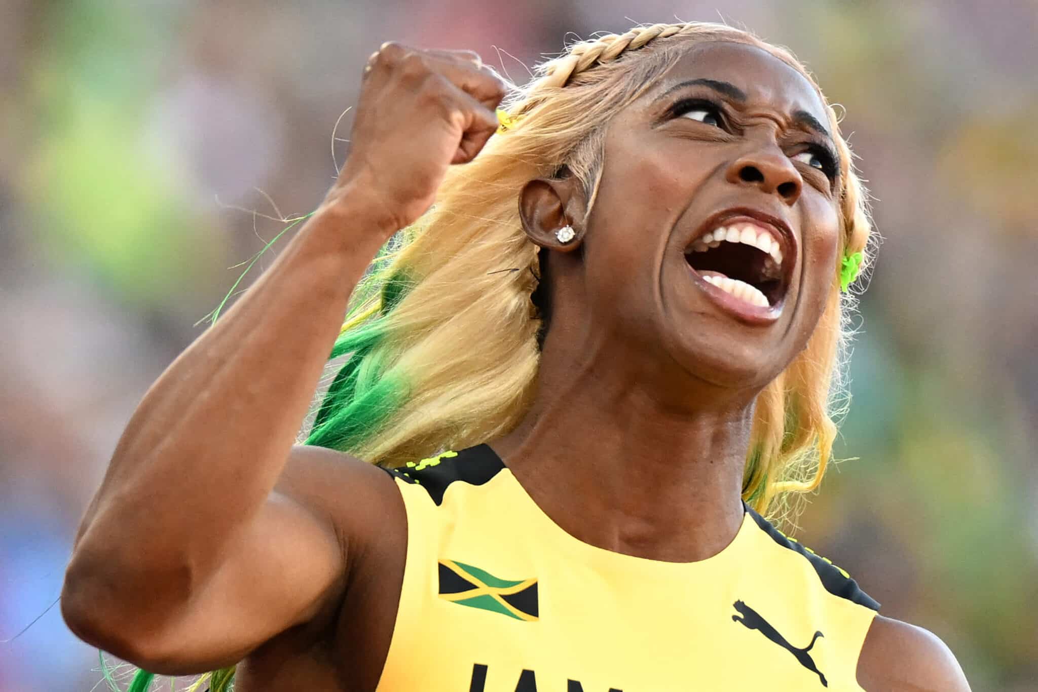 Jamaica's Shelly-Ann Fraser-Pryce celebrates after winning the women's 100m final during the World Athletics Championships at Hayward Field in Eugene, Oregon on July 17, 2022.