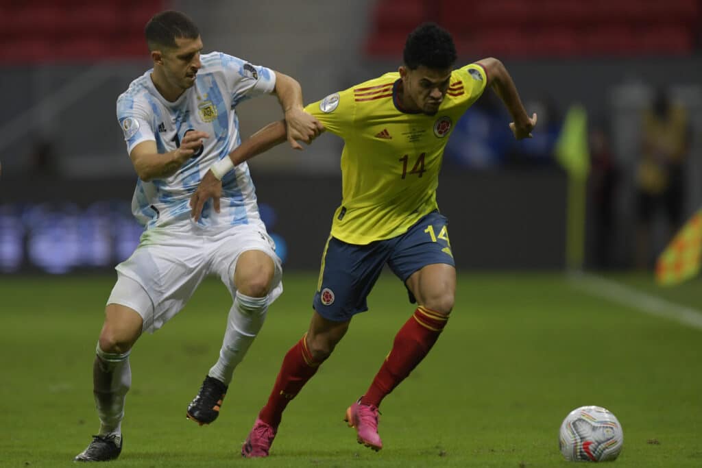 Luis Diaz of Colombia and Guido Rodriguez of Argentina compete for the ball in the semi-final match between Argentina and Colombia in the 2021 Copa America.