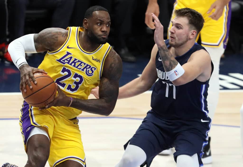 LeBron dribbles the ball against Mavericks, Luka Doncic