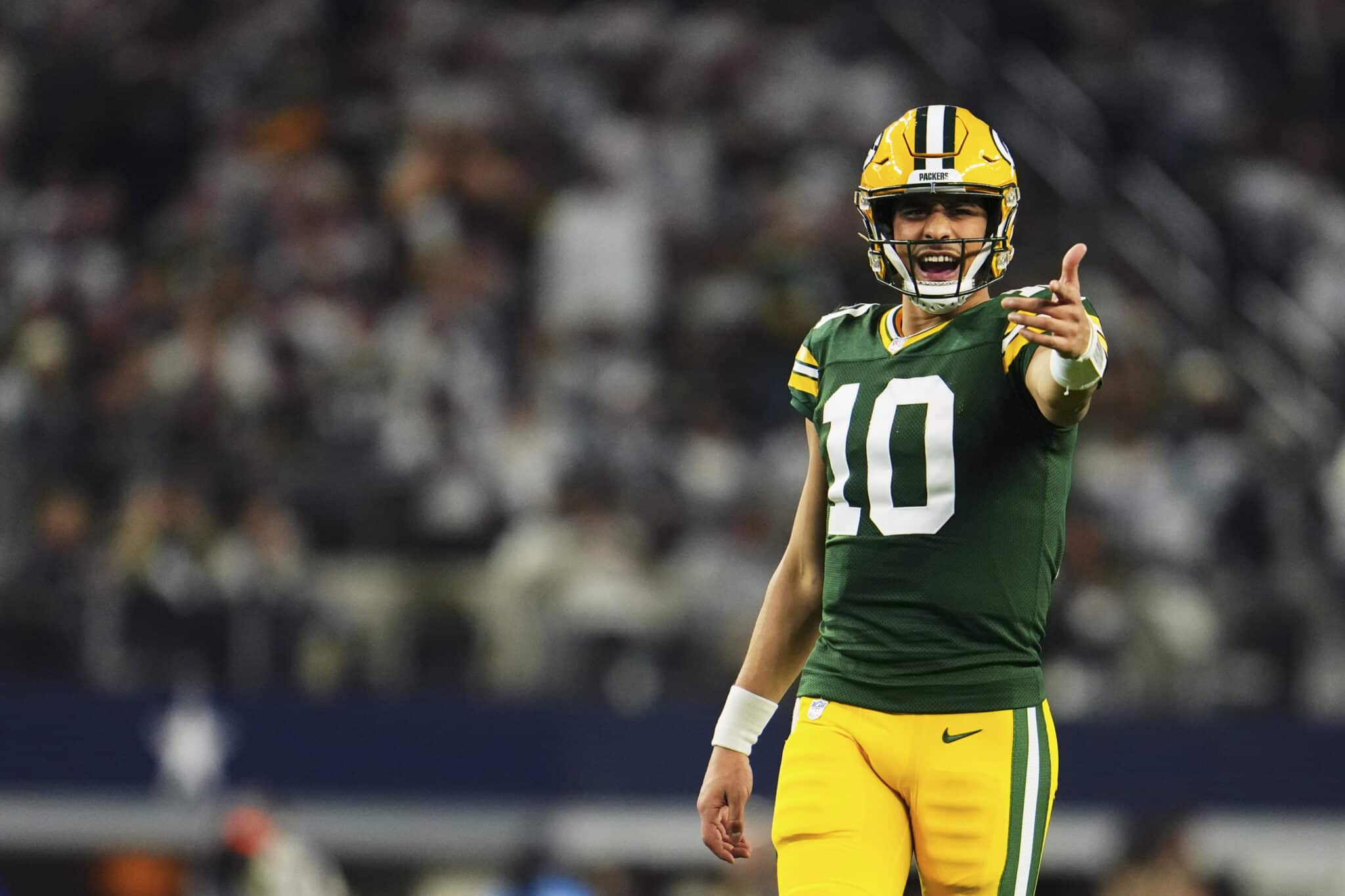 Jordan Love #10 of the Green Bay Packers reacts after a play against the Dallas Cowboys during the second half of the NFC Wild Card playoff game at AT&T Stadium on January 14, 2024 in Dallas, Texas.