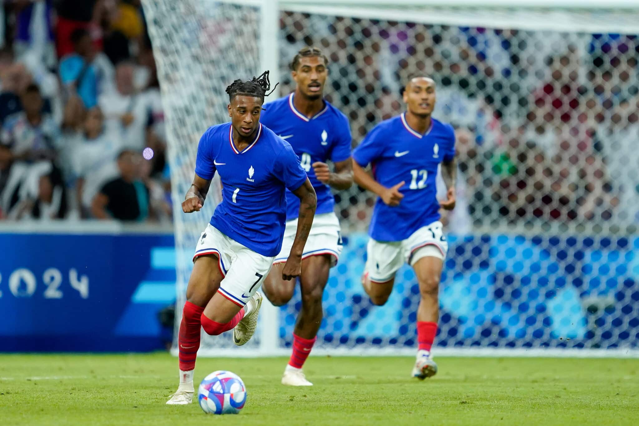 MARSEILLE, FRANCE - JULY 24: Michael Olise #7 of France goes forward with the ball during the Men's group A match between France and United States during the Olympic Games Paris 2024 at Stade de Marseille on July 24, 2024 in Marseille, France.