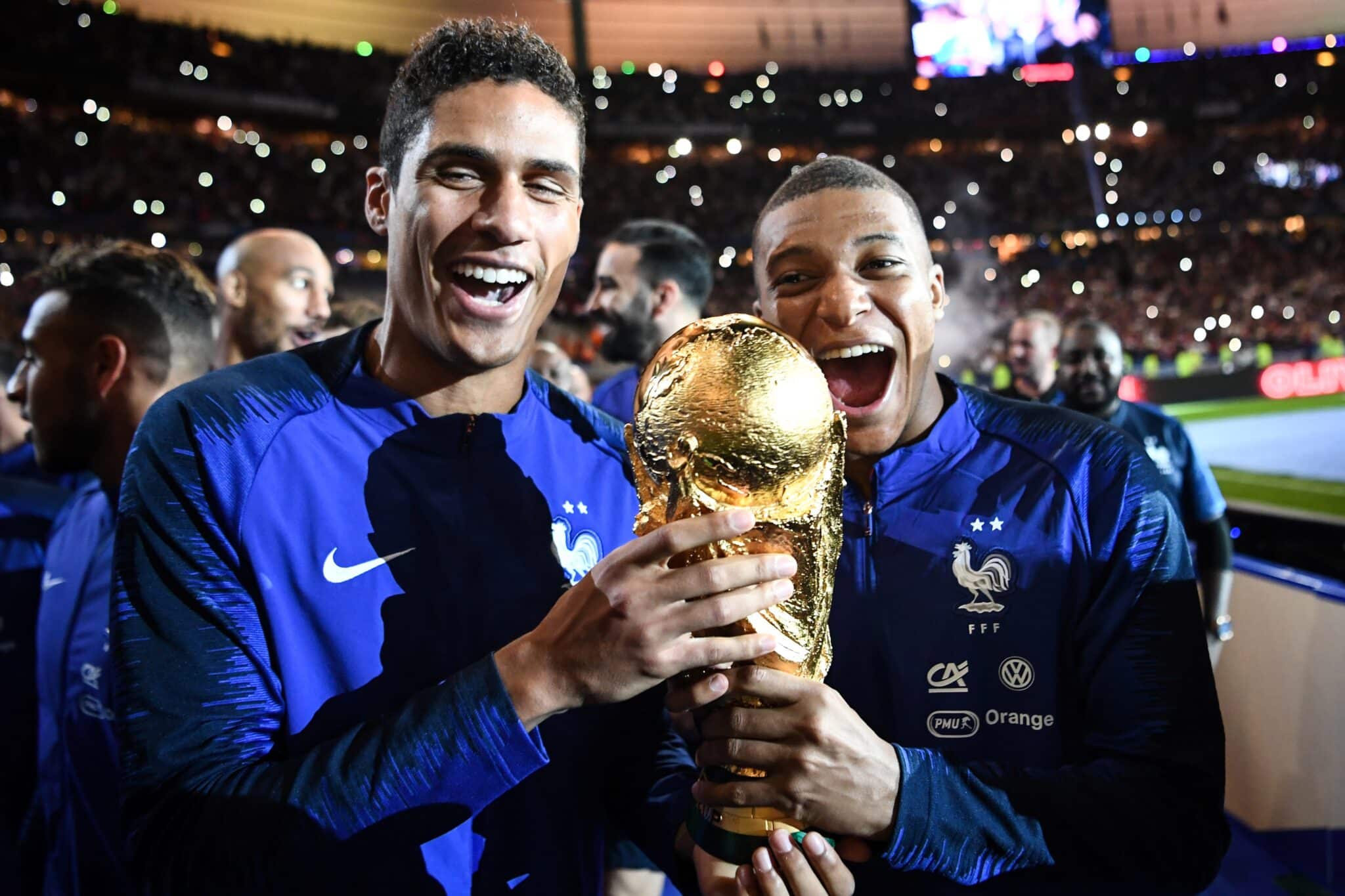 Football Lore - Kylian Mbappe and Raphael Varane celebrate France's World Cup win