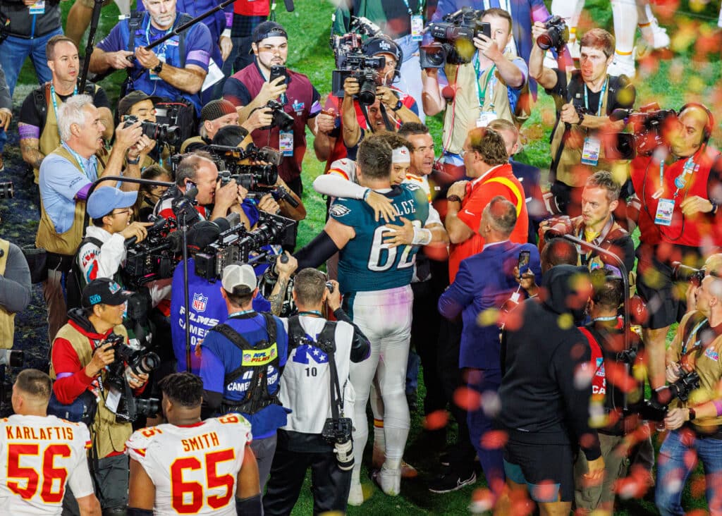 Kansas City Chiefs quarterback Patrick Mahomes (15) and Philadelphia Eagles center Jason Kelce (62) embrace after Super Bowl LVII between the Philadelphia Eagles and the Kansas City Chiefs on Sunday,