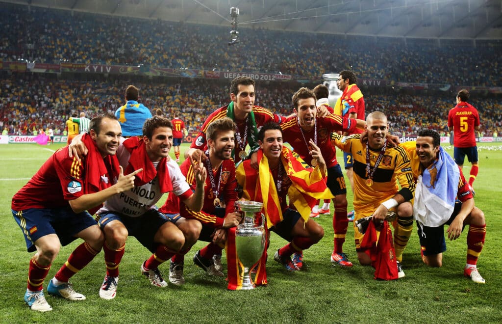 Andres Iniesta, Cesc Fabregas, Gerard Pique, Sergio Busquets, Xavi Hernandez, Jordi Alba, Victor Valdes and Pedro of Spain pose with the trophy following victory in the UEFA EURO 2012 final 