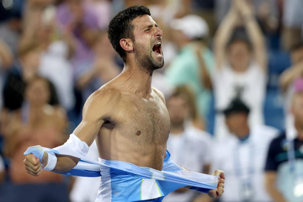 Novak Djokovic of Serbia tears his shirt off 