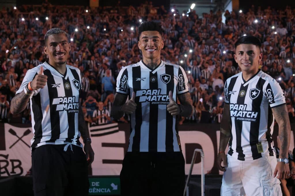 Allan, Igor Jesus and Thiago Almada pose during their unveiling as new players of Botafogo prior to the match between Botafogo and Atletico Mineiro 