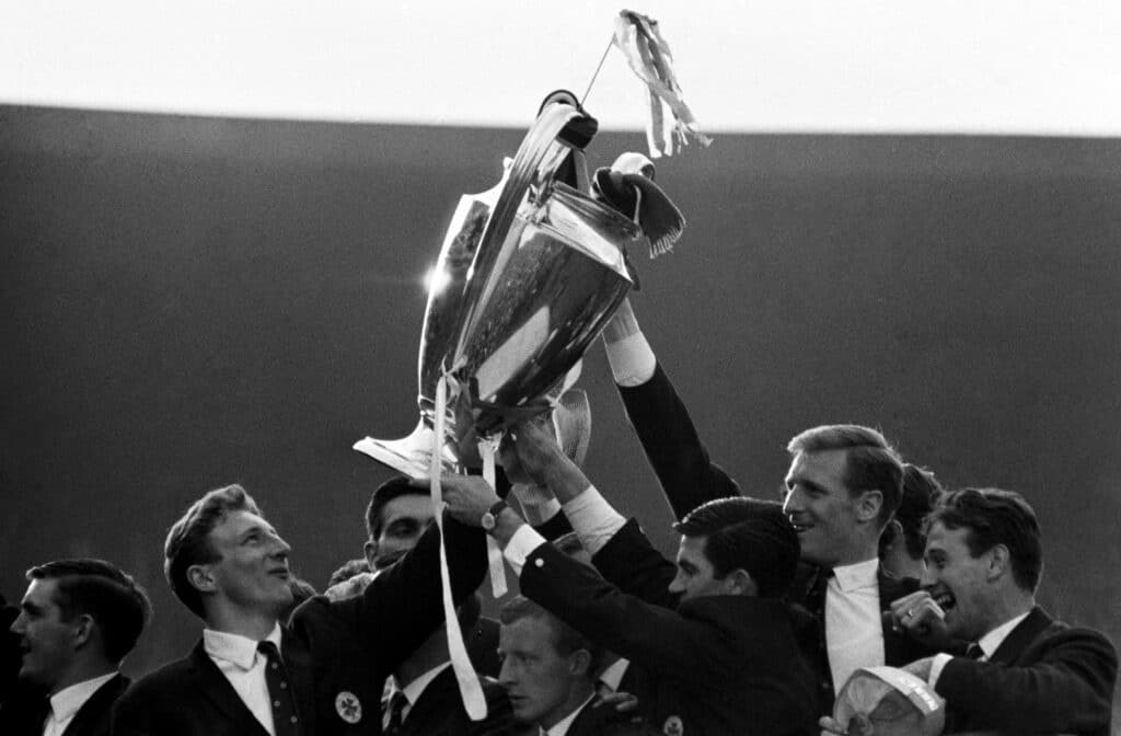 The delighted Celtic players show off the European Cup to their fans.