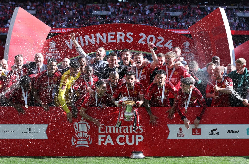 Football: Bruno Fernandes of Manchester United lifts the FA Cup trophy with teammates after the Emirates FA Cup Final