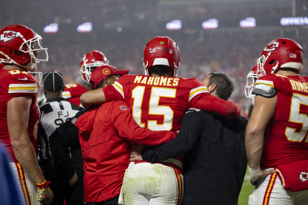 Patrick Mahomes #15 of the Kansas City Chiefs is helped off the field after an apparent injury